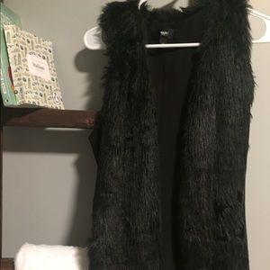 Long black faux fur vest